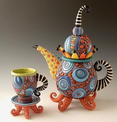 Beautiful hand made teapot, carved and painted with glaze and under-glaze